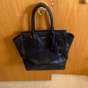 A black leather Coach tote bag